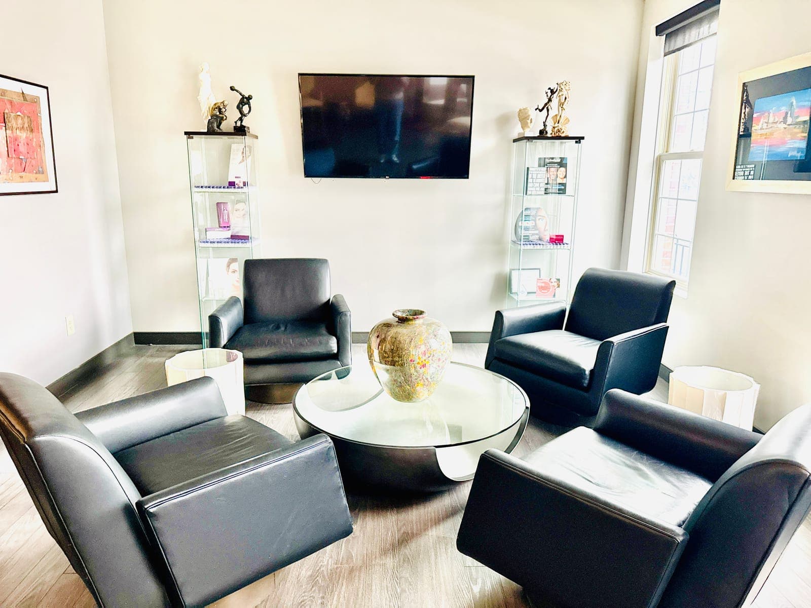 Private consultation room with leather chairs and curated artwork