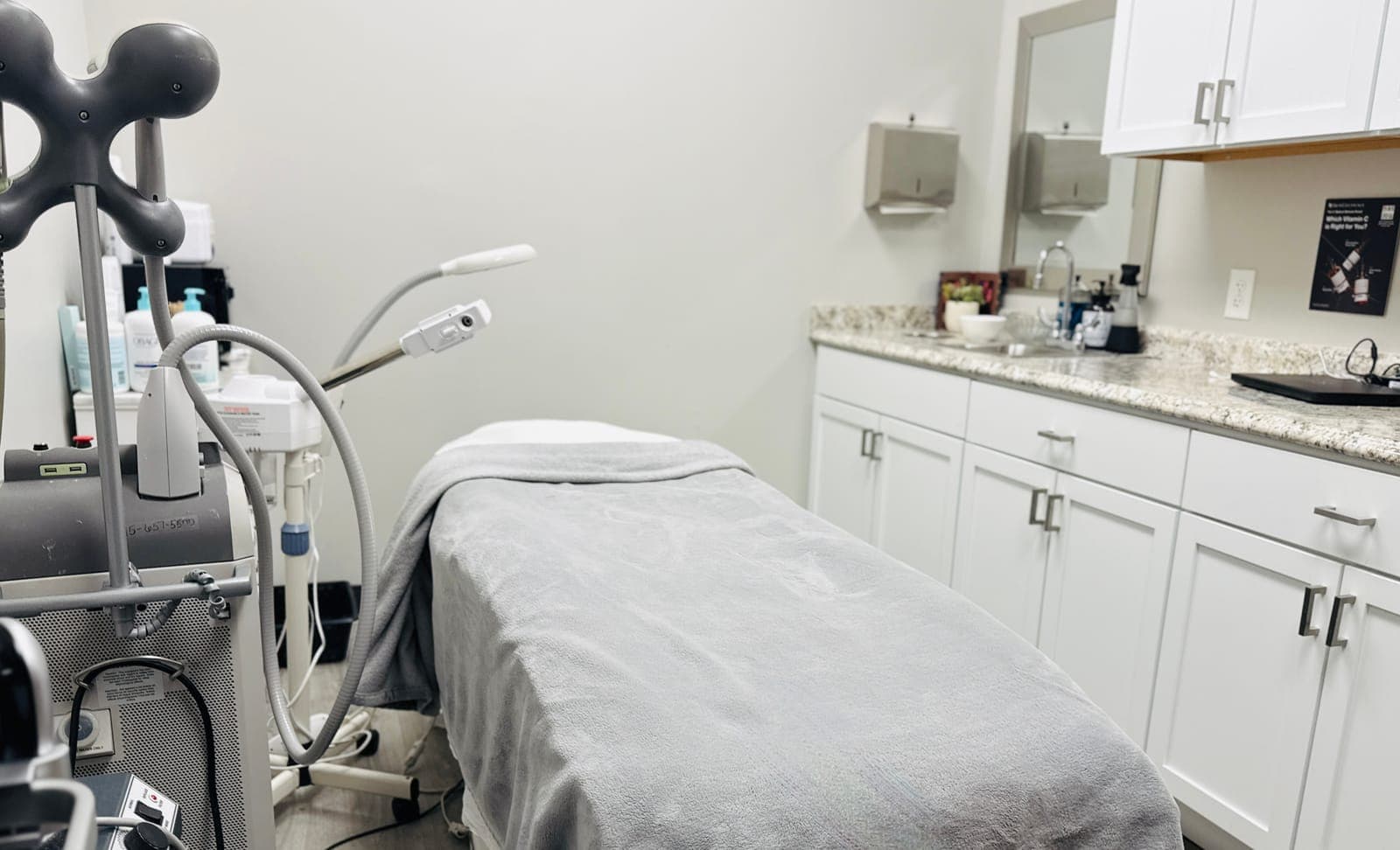 Procedure room with treatment table and medical cabinetry