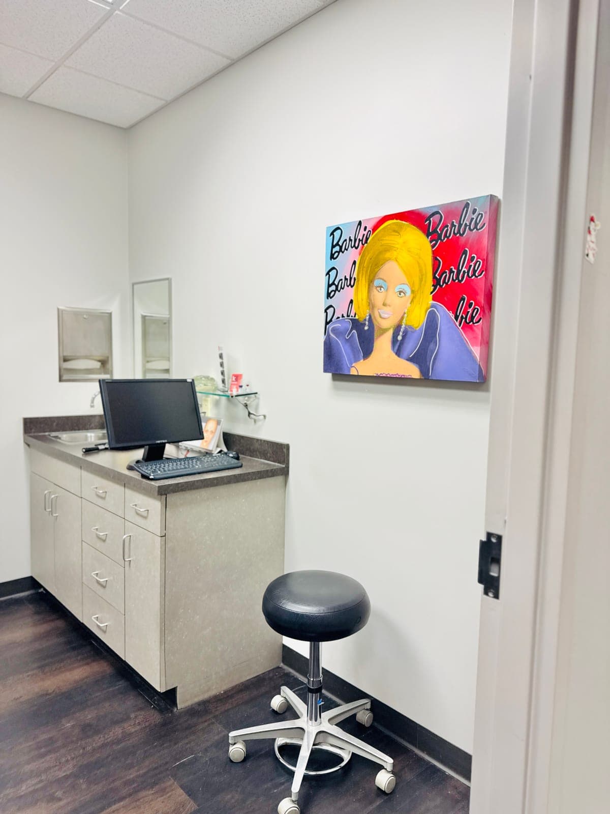 Procedure room with pop-art Barbie painting