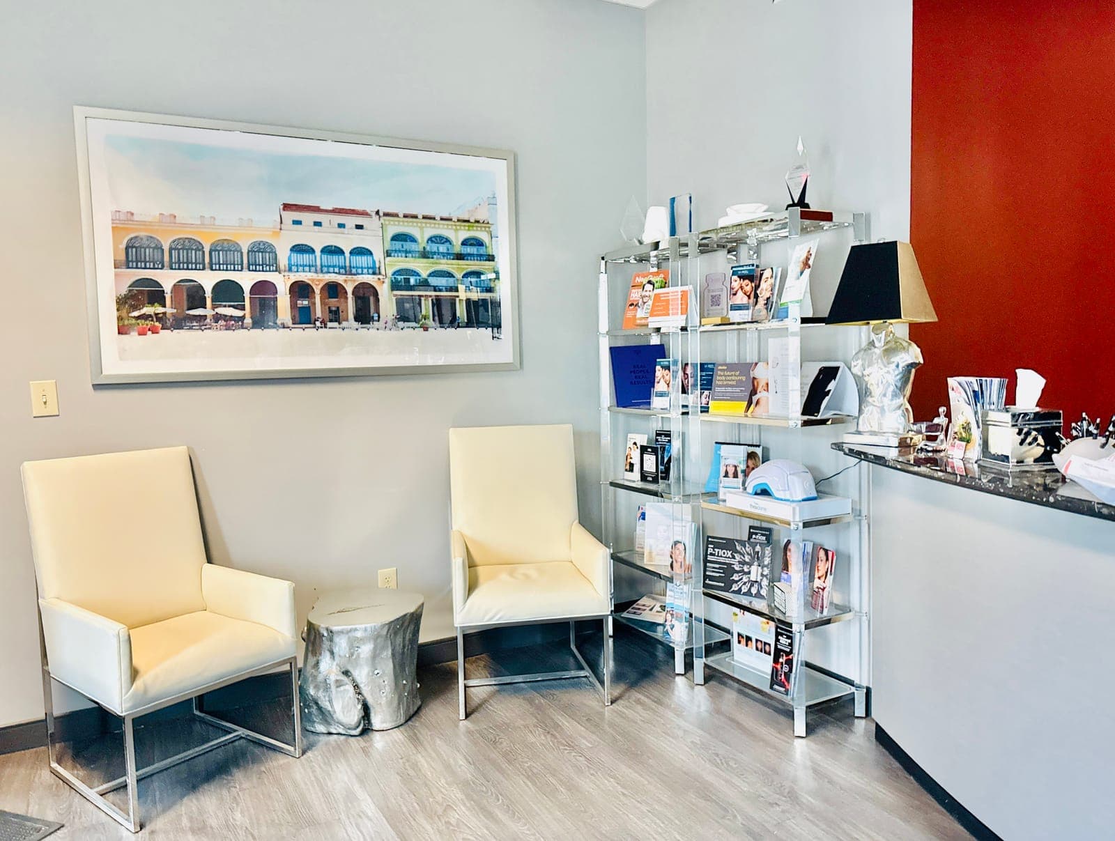 Reception waiting area with coastal artwork and product display